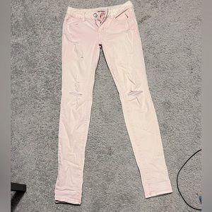 Pink distressed/ripped Jeggings from American Eagle